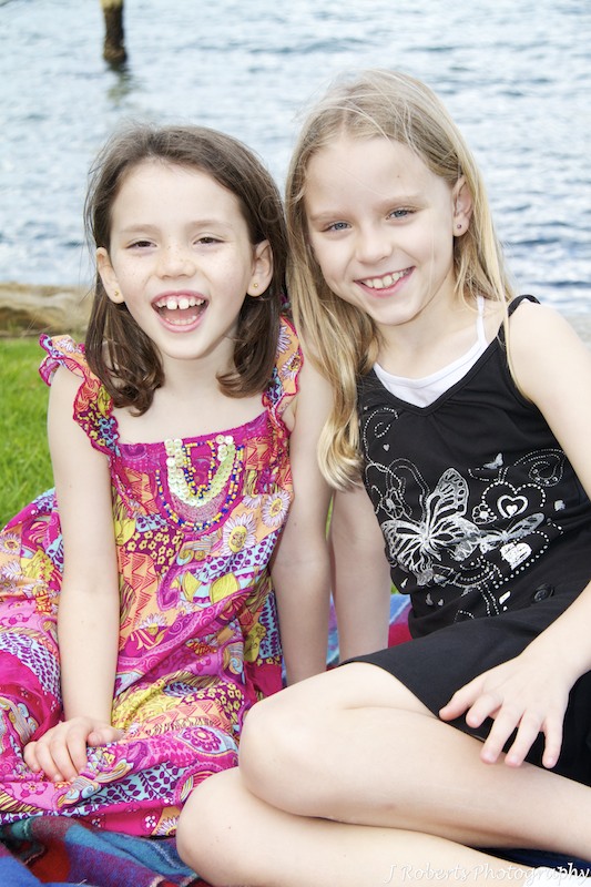 Sisters smiling - family portrait photography sydney